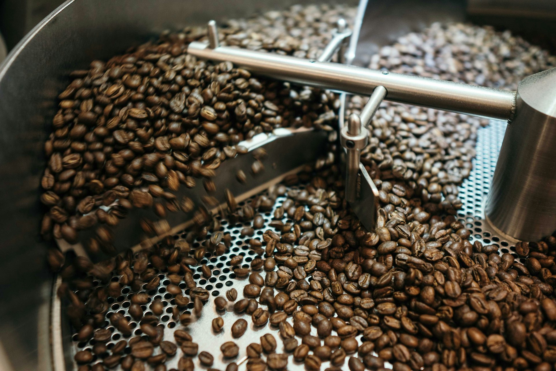 Yad Coffee | Ethiopian coffee beans undergoing the roasting process in a traditional or commercial coffee lot, showcasing the transformation of green beans.